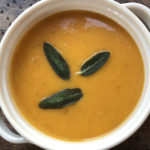 bowl of butternut squash soup with sage and fried sage leaves